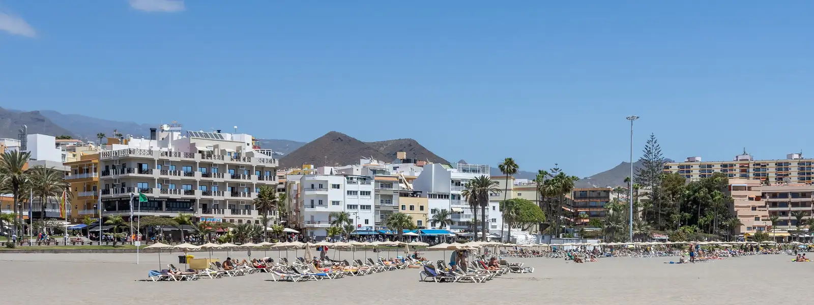 Los Cristianos beach in Arona, with the promenade and seafront buildings