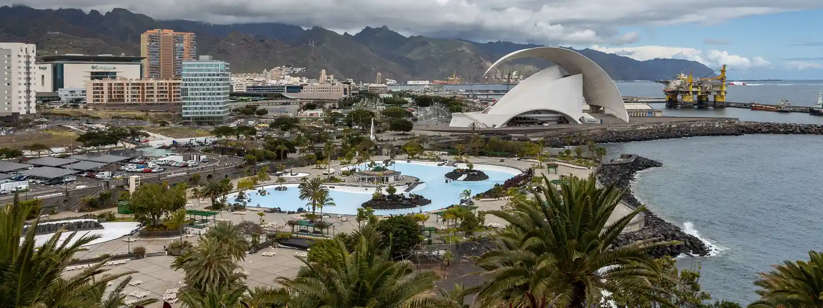 View of Santa Cruz de Tenerife from the Palmetum, with the Auditorio de Tenerife by the sea